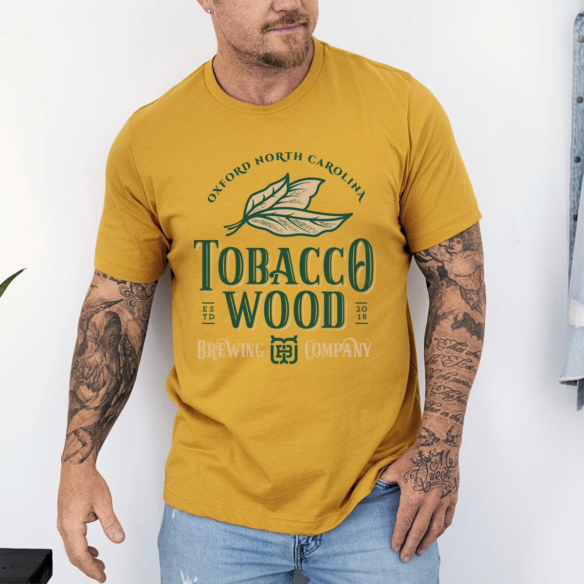 Tobacco Wood Brewing short sleeve T-shirt by Winks Design Studio, LLC showing a casual, fitted cotton T-shirt with graphic print.