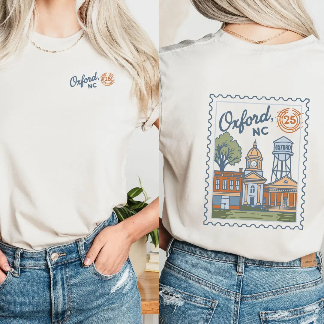 Winks Design Studio Oxford NC Postmark T-shirt featuring a casual fit and printed postmark design on soft fabric.