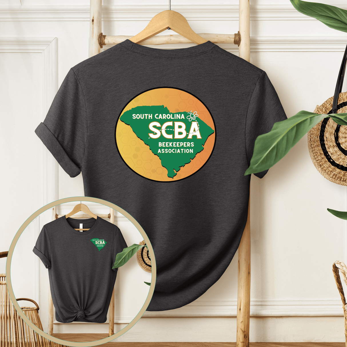 SCBA Short Sleeve T-Shirt with South Carolina Beekeepers Association logo displayed on a wooden hanger