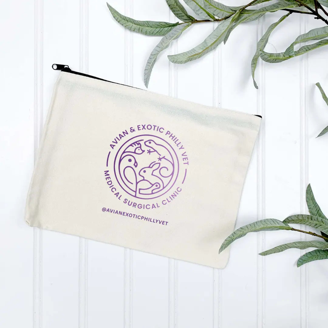 Winks Design Studio Avian Exotic wristlet cosmetic bag with colorful bird and floral pattern, compact and stylish for travel or daily use.