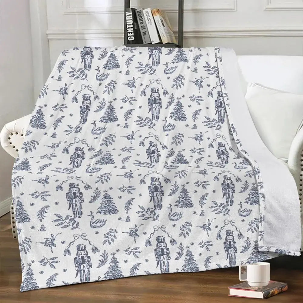 Elegant Nutcracker Christmas blanket by Winks Design Studio, LLC featuring festive nutcracker and holiday-themed cozy fabric.