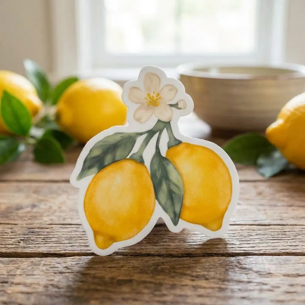 Colorful Lemon Blossom waterproof sticker by Winks Design Studio, LLC, featuring vibrant lemon and floral design on a clear background.