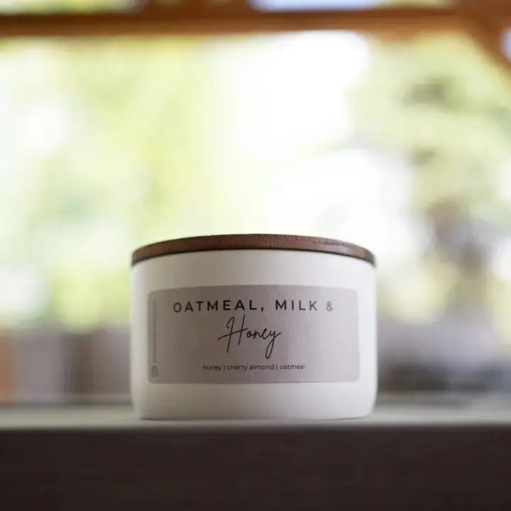 Winks Design Studio Milkhouse Candle in Oatmeal, Milk &amp; Honey scent, 10 oz statement candle with a cozy, decorative design.