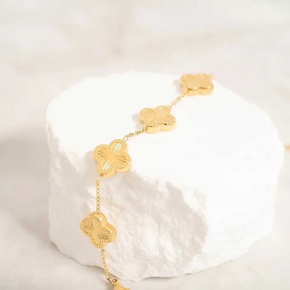 Gold Lucky Clover Charm Bracelet with four-leaf clover design by Winks Design Studio, LLC.