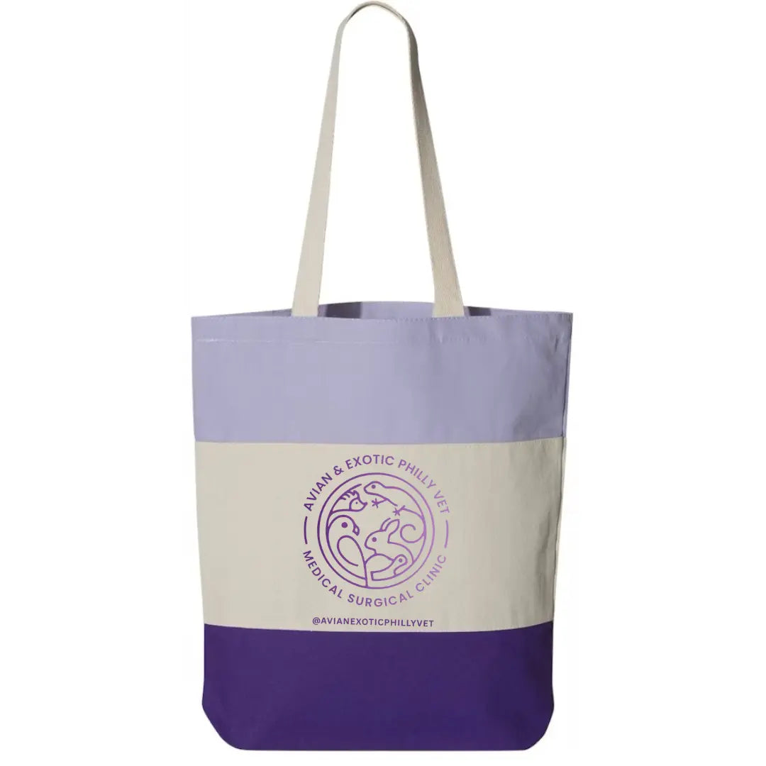 Tri-color tote bag by Winks Design Studio, LLC featuring a vibrant bird design, spacious interior, and sturdy handles.