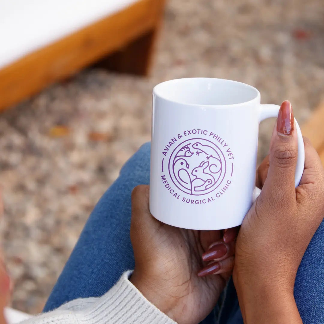 Ceramic mug featuring colorful avian exotic bird design by Winks Design Studio, LLC, with a smooth handle and glossy finish.