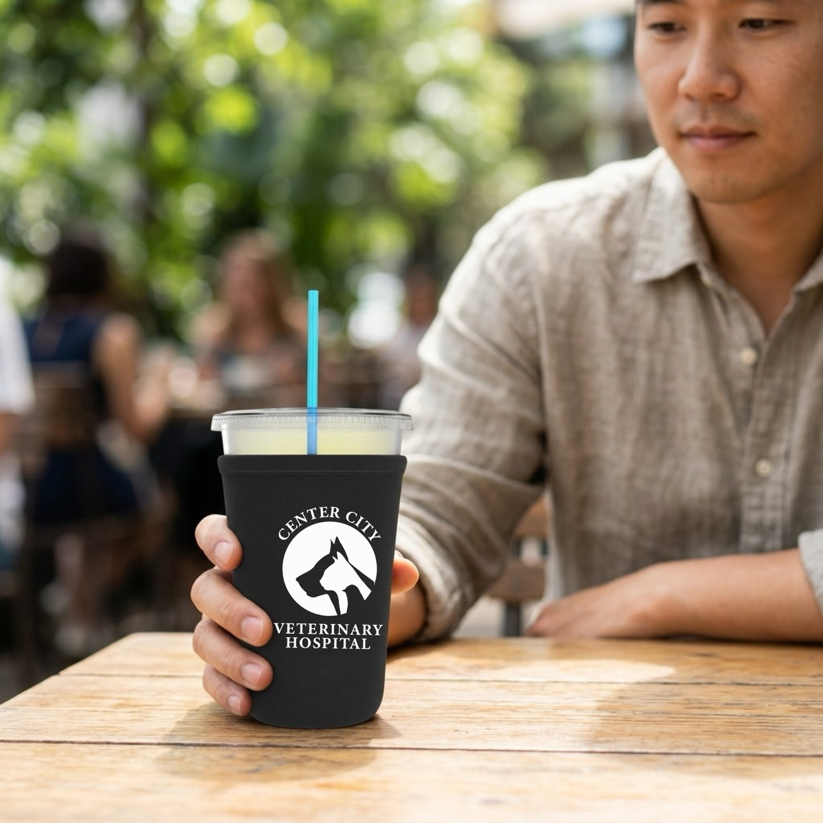 Winks Design Studio Center City Vet neoprene cup sleeve with vibrant cityscape pattern, fits standard beverage cups for insulation.