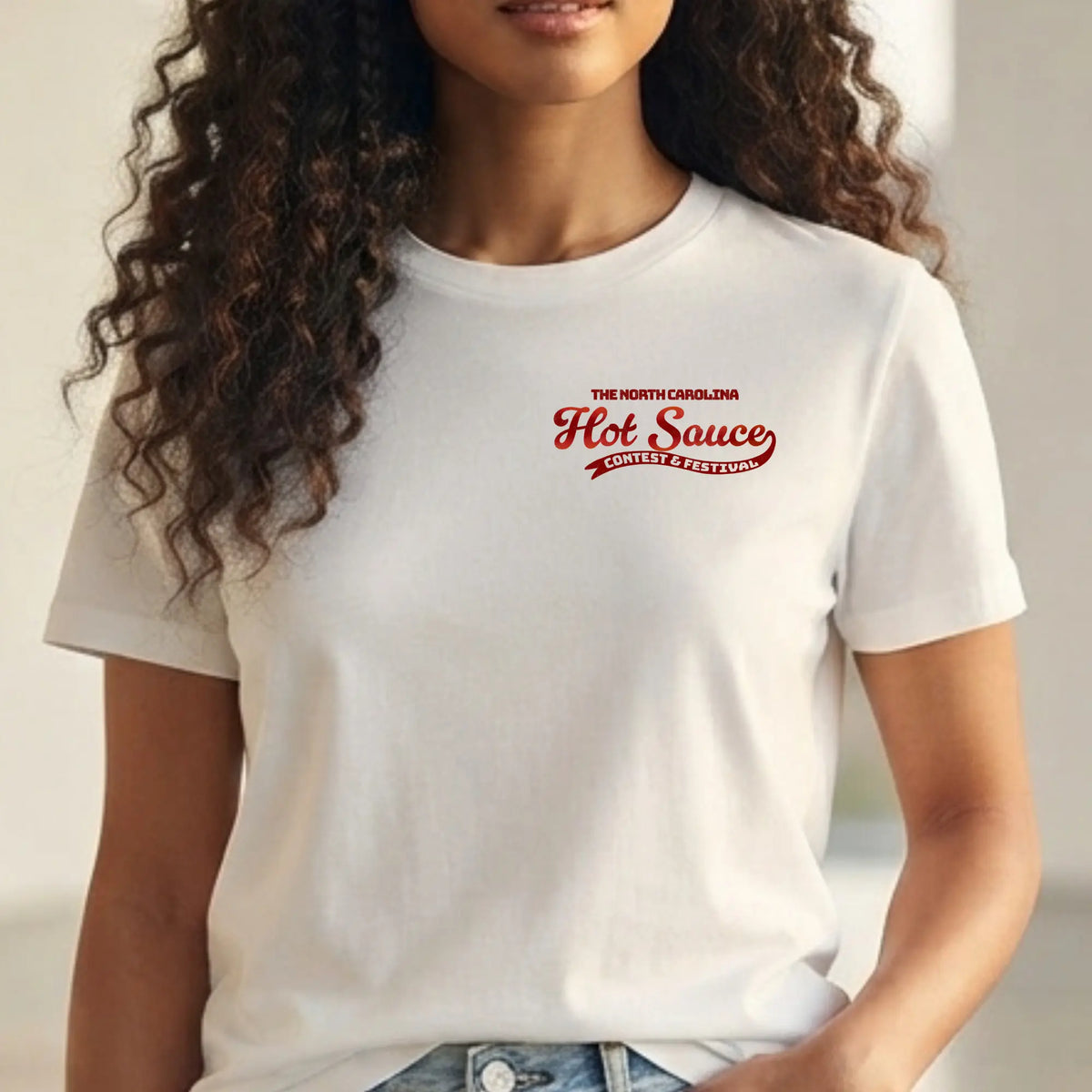 Retro character T-shirt from Winks Design Studio featuring NC Hot Sauce Festival artwork, casual cotton tee with vibrant design.