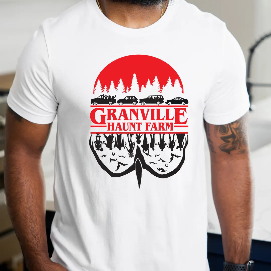 Winks Design Studio LLC Granville Haunt Farm upside-down T-shirt featuring spooky farm-themed graphic on black cotton fabric.