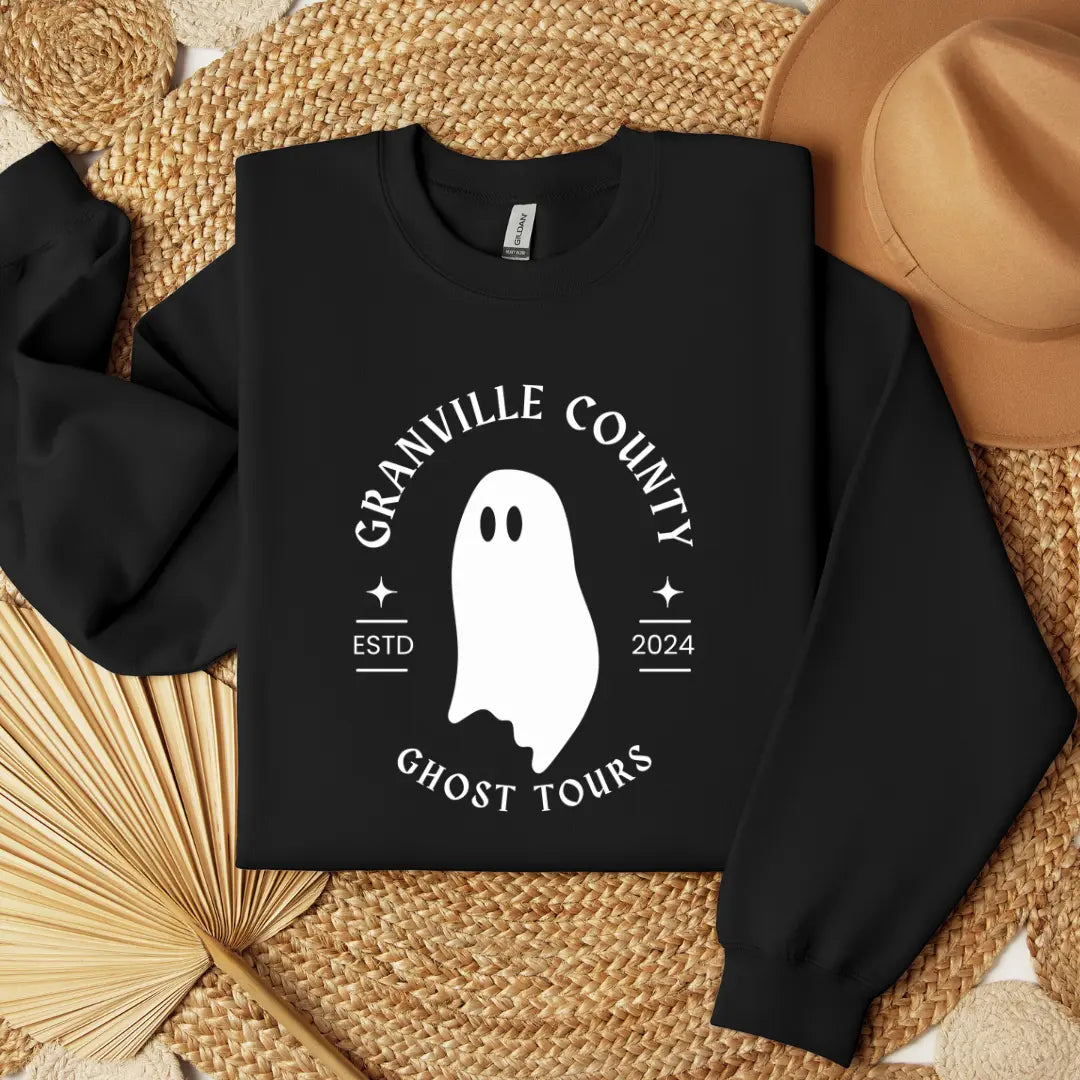 Winks Design Studio, LLC Granville County Ghost Tours crewneck sweatshirt with ghostly graphic and crewneck collar.