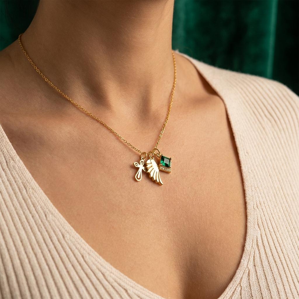 Gold Gatsby Emerald Charm jewelry by Winks Design Studio, LLC featuring a gold charm with an emerald gemstone.