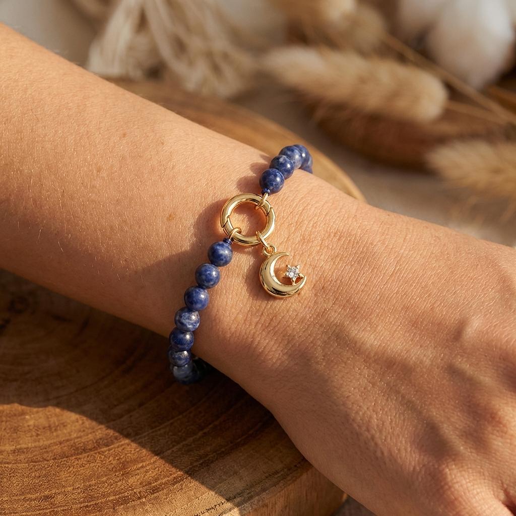 Tiny moon and star charm jewelry by Winks Design Studio, LLC, featuring delicate celestial charms on a jewelry chain.
