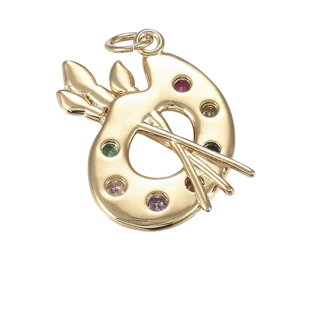 Gold and zirconia artist palette charm featuring detailed paintbrush and palette design, crafted by Winks Design Studio LLC.