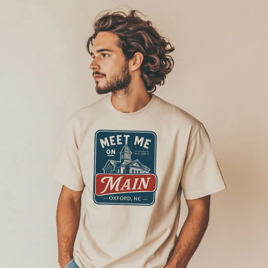 Winks Design Studio Meet Me on Main T-Shirt showing a casual cotton T-shirt with printed text in a relaxed fit.