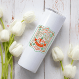 NC Hot Sauce Contest & Festival 20oz tumbler with vintage label design among white tulips.