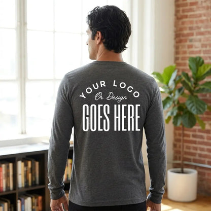 Back view of a dark heather gray custom long sleeve t-shirt with a large white "Your Logo or Design Goes Here" back placeholder print