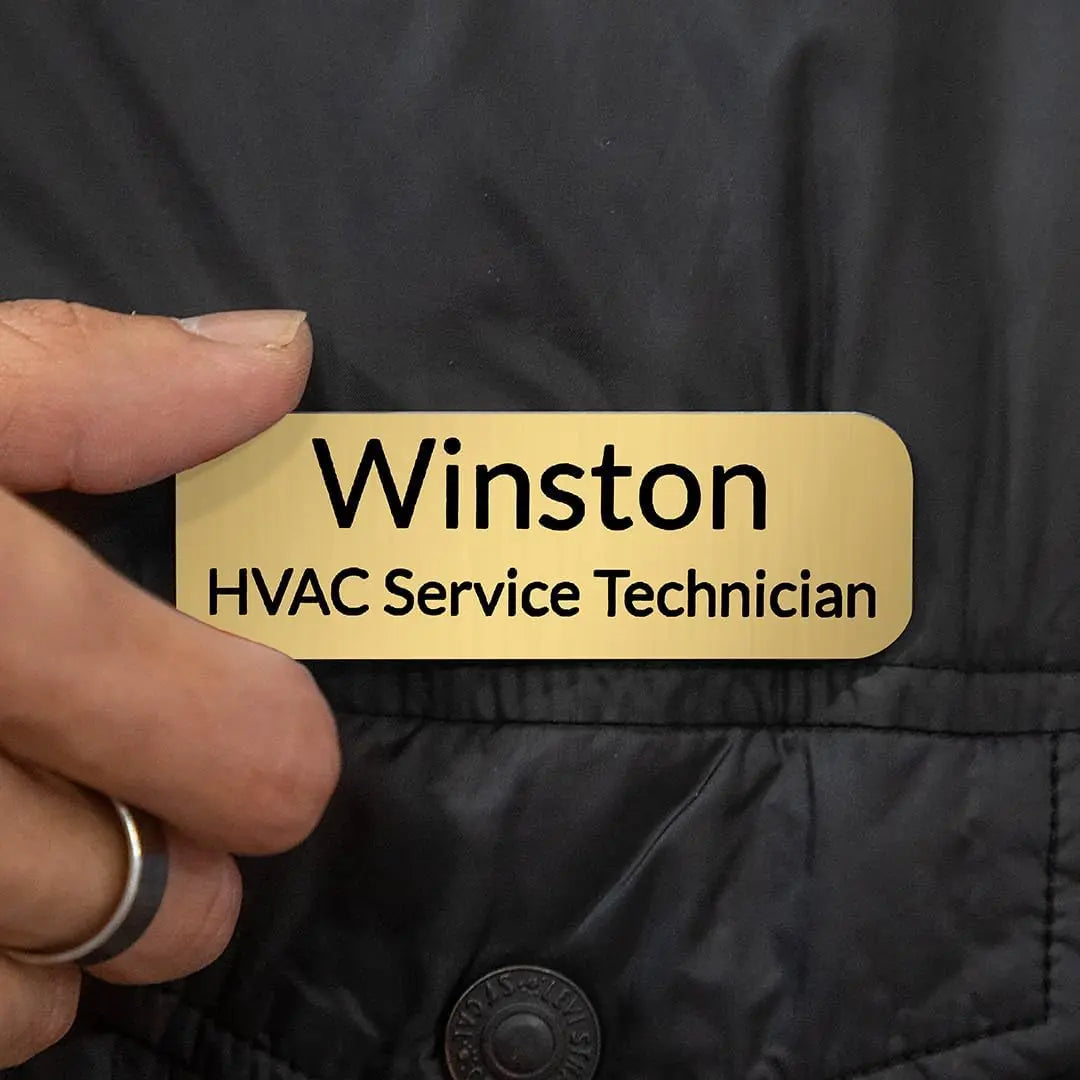 Custom engraved magnetic name badge by Winks Design Studio, LLC with a professional design and secure magnetic backing.