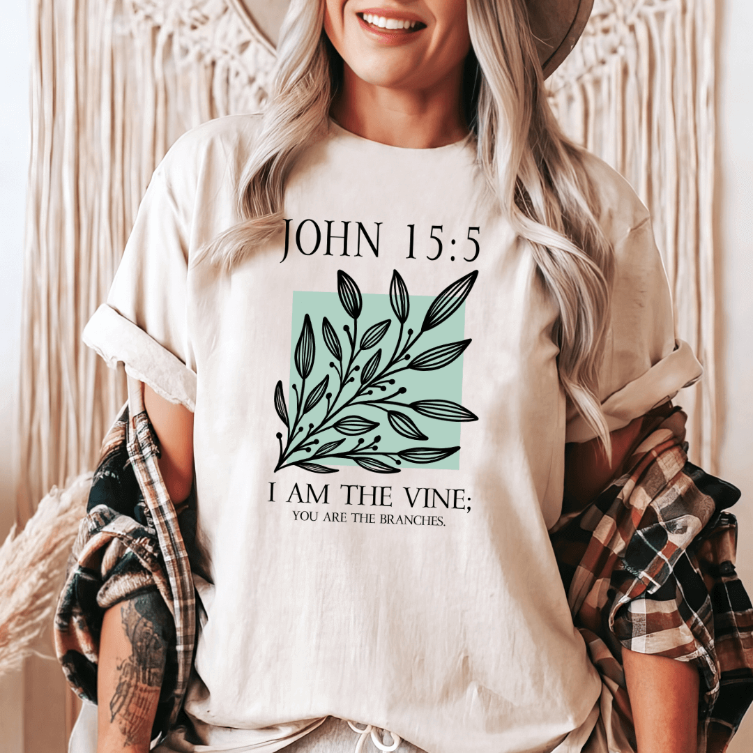 a woman wearing a t - shirt that says john 15 5 i am the vine