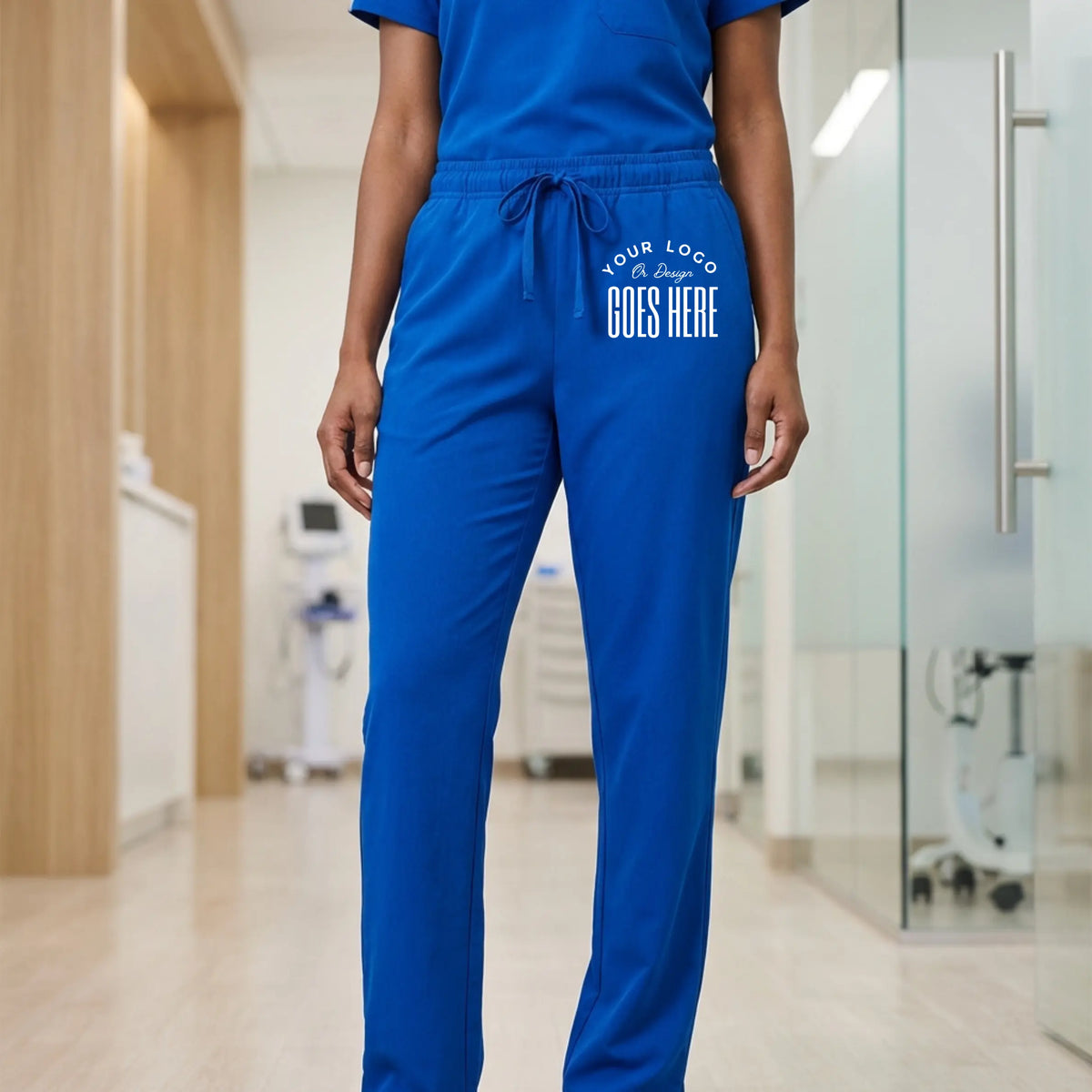 Custom Jaanuu unisex Rhodes straight-leg scrub pants in navy, featuring a relaxed fit and functional pockets.