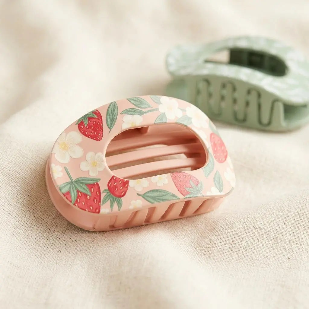 Winks Design Studio LLC Sweet Summer Strawberry claw clip securing hair with a red and green strawberry design.