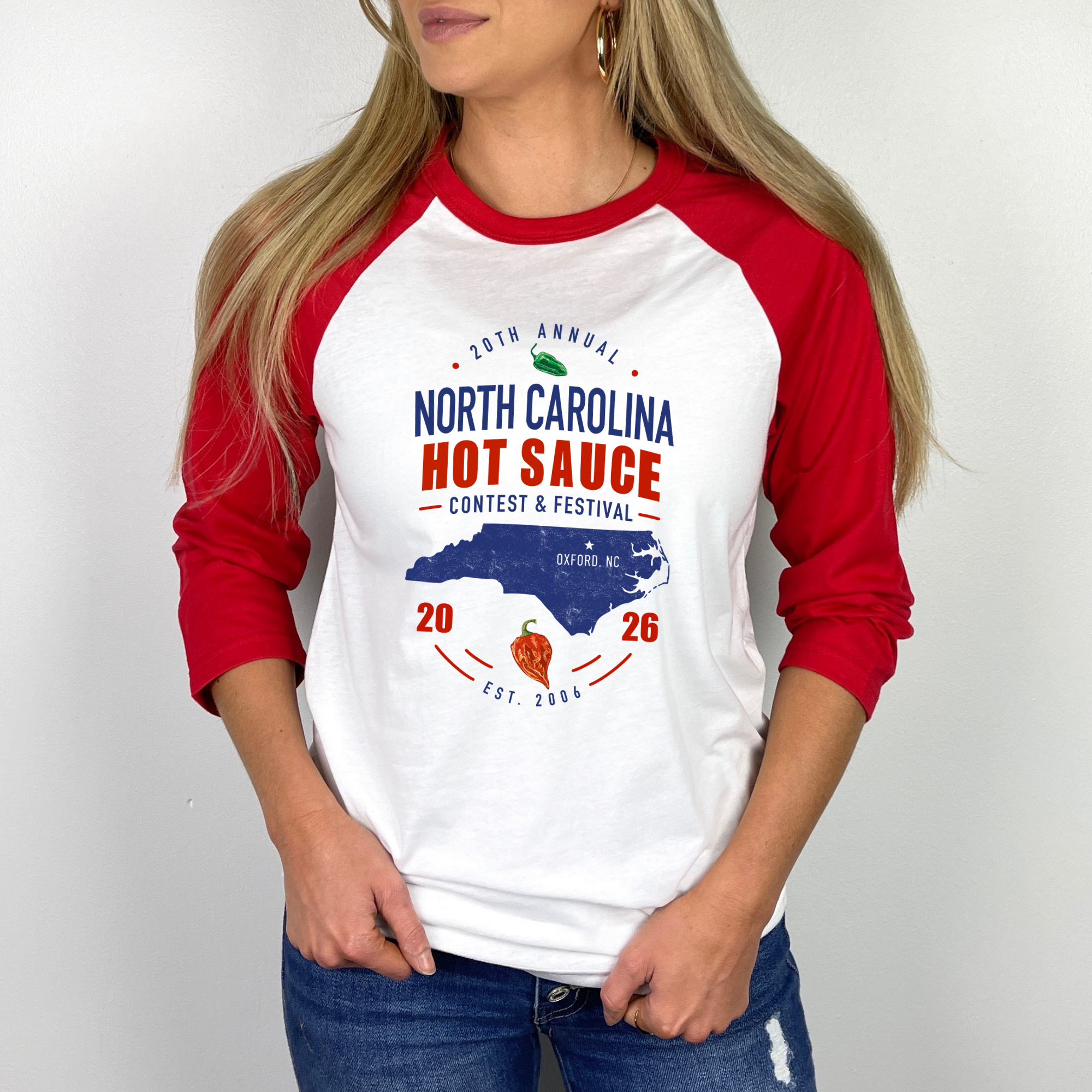 Winks Design Studio Carolina Classic Raglan shirt featuring hot sauce festival graphic on a casual raglan style.