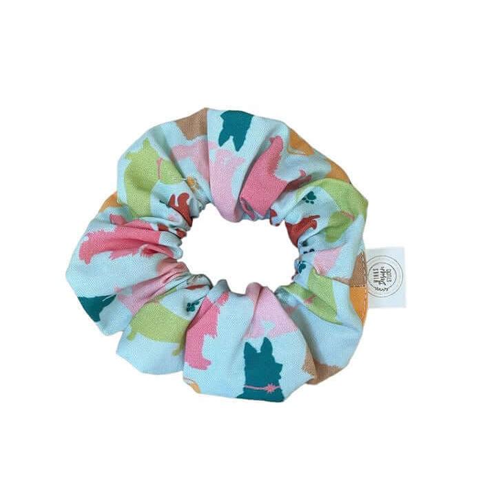 Colorful dog-themed scrunchie with playful pup print showcasing a stylish accessory for dog lovers.