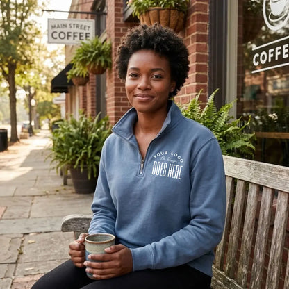 Slate blue custom quarter zip sweatshirt with a white "Your Logo or Design Goes Here" left chest placeholder print