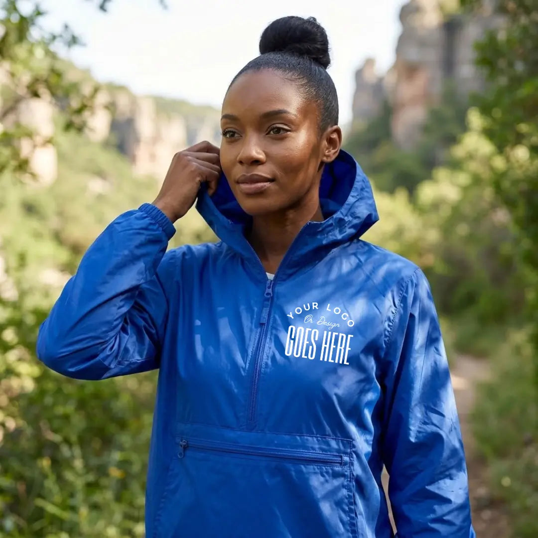 Royal blue custom quarter zip pullover windbreaker with a white "Your Logo or Design Goes Here" left chest placeholder print