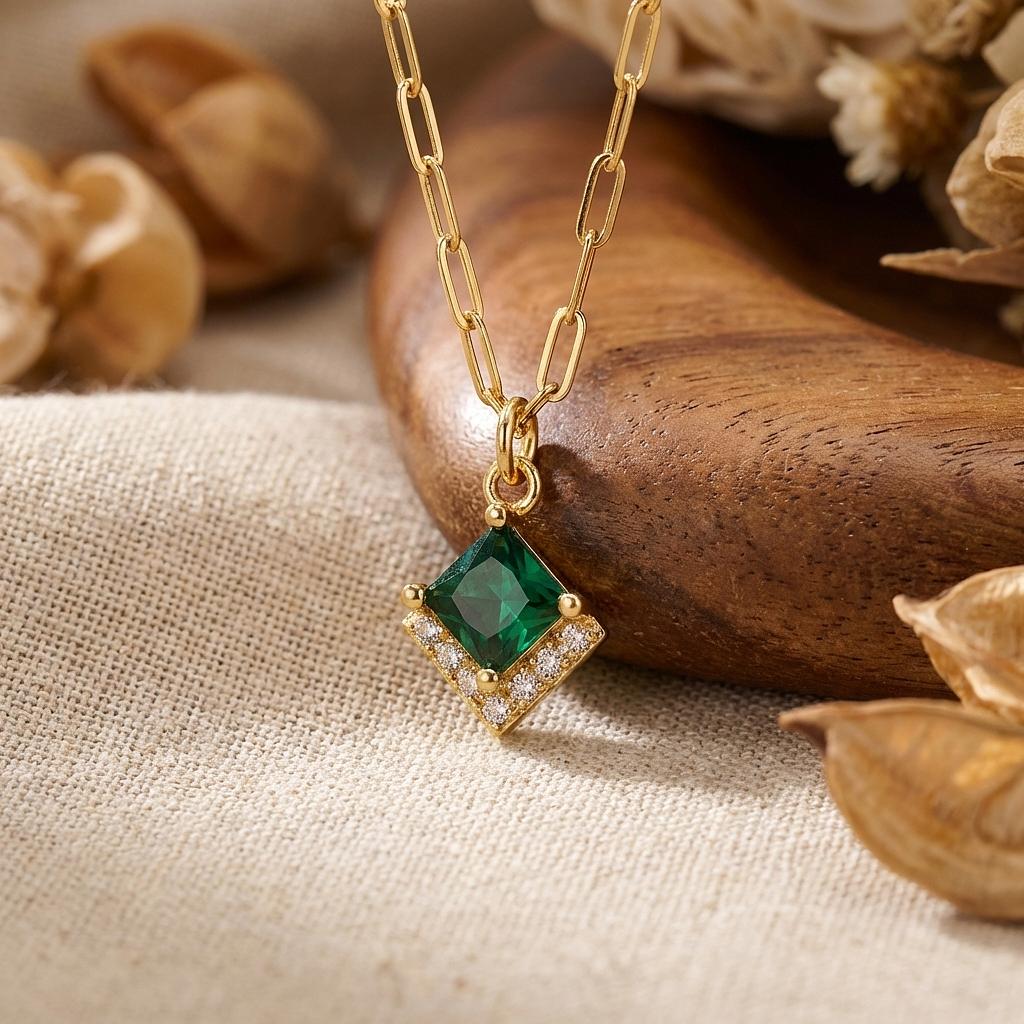 Gold Gatsby Emerald Charm from Winks Design Studio LLC, a jewelry charm featuring a gold setting and emerald gemstone detail.