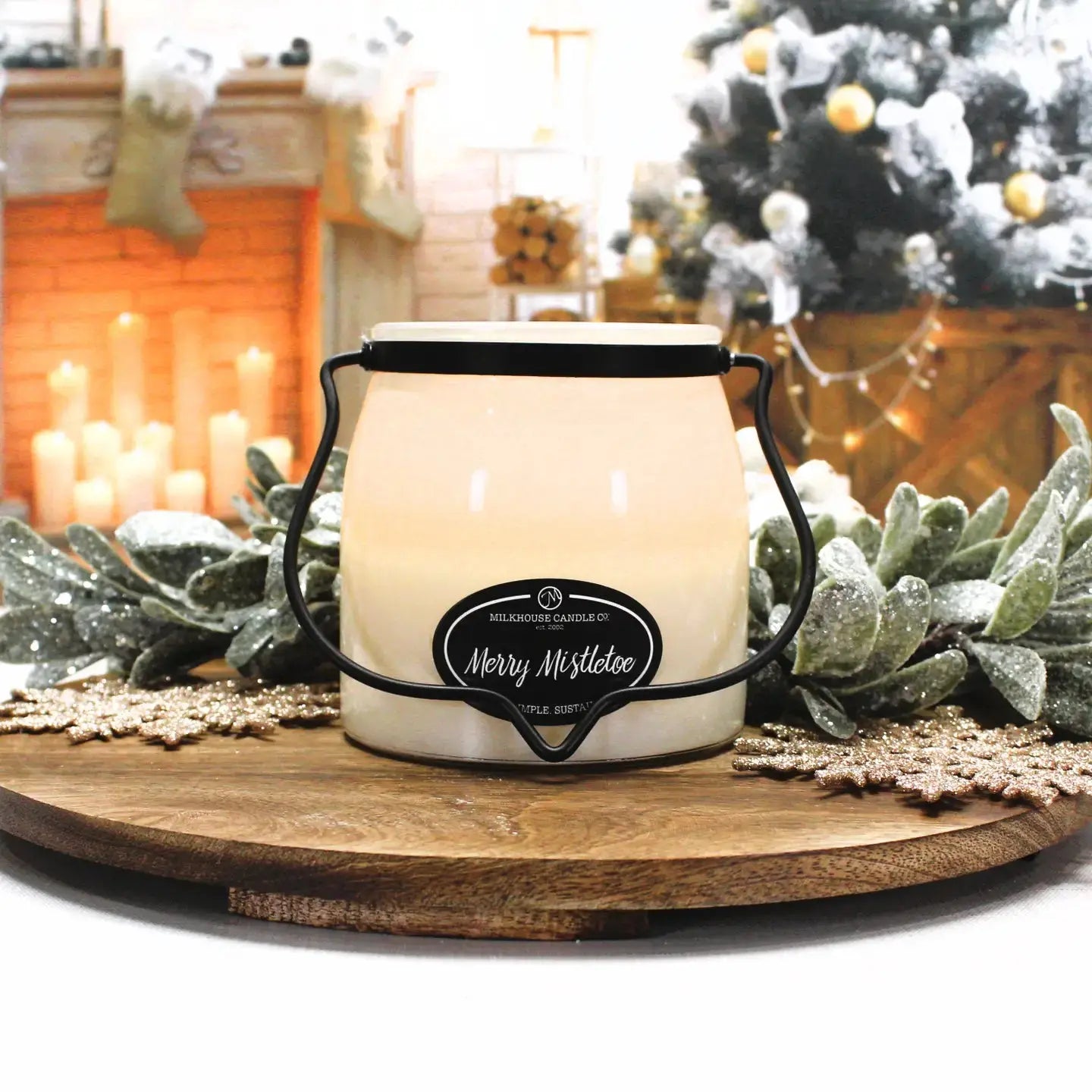 Winks Design Studio Merry Mistletoe 16 oz Butter Jar Candle with festive mistletoe design and warm candle glow