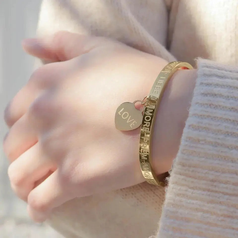 Gold-plated Love Languages Heart Charm Bangle bracelet with engraved heart design, stylish jewelry by Winks Design Studio, LLC.