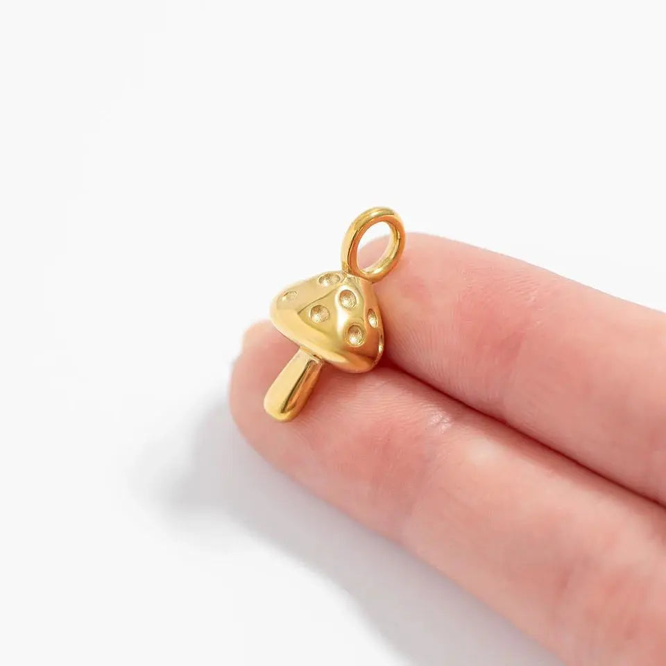 18K gold mushroom charm by Winks Design Studio, LLC, featuring a detailed, small mushroom design perfect for jewelry or charms.