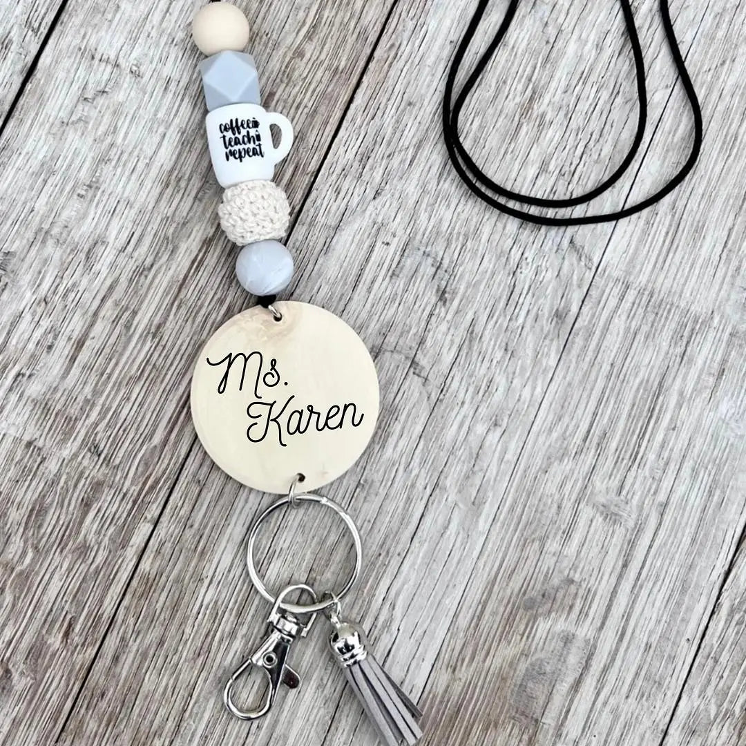 Custom silicone teacher bead lanyard necklace with colorful beads and a clip, designed for educators by Winks Design Studio, LLC.