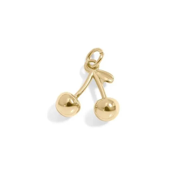 18K gold cherry charm jewelry by Winks Design Studio, LLC, featuring a detailed cherry fruit design on a small charm.