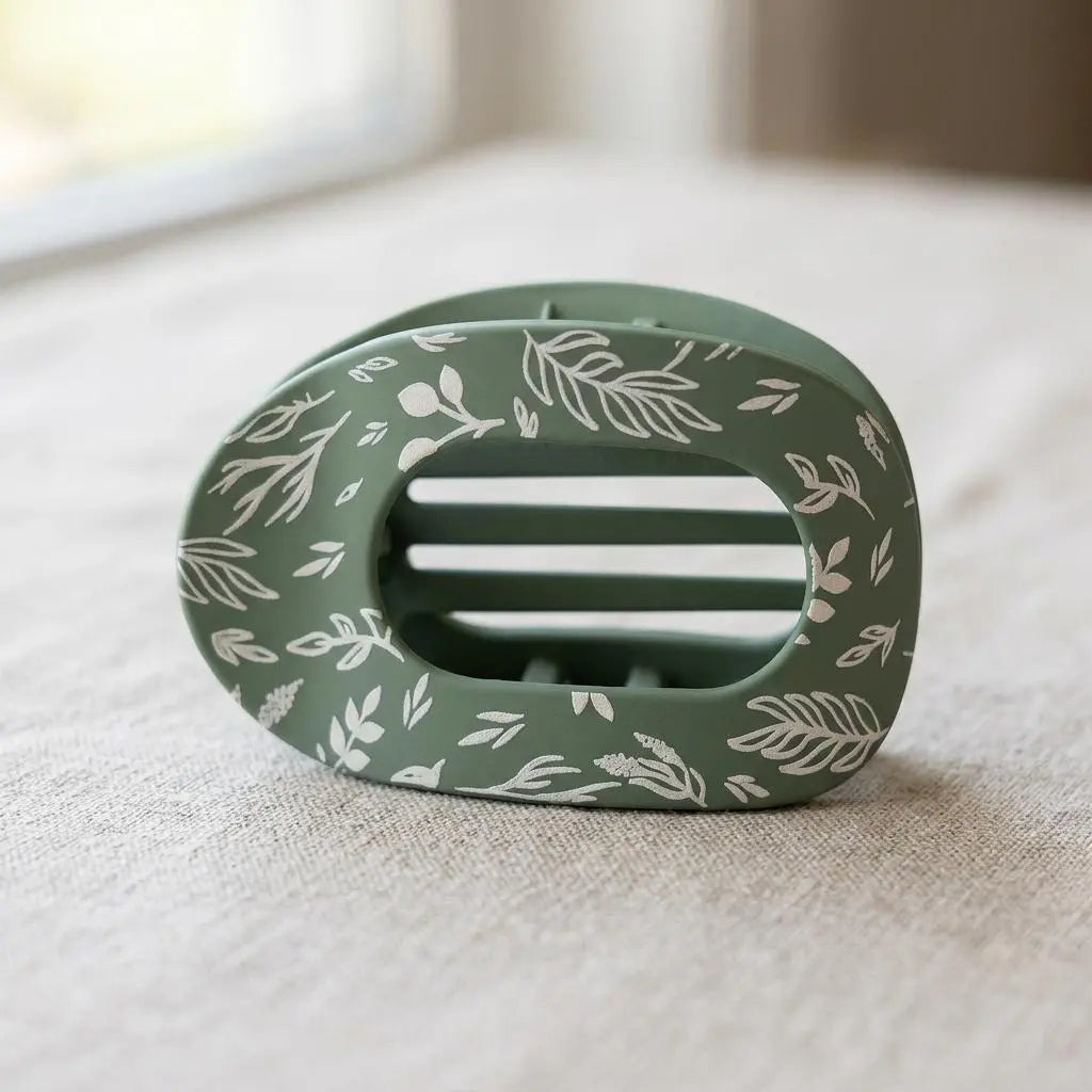 Sage and stem claw clip by Winks Design Studio, LLC, showcasing a stylish hair accessory with a natural green design.