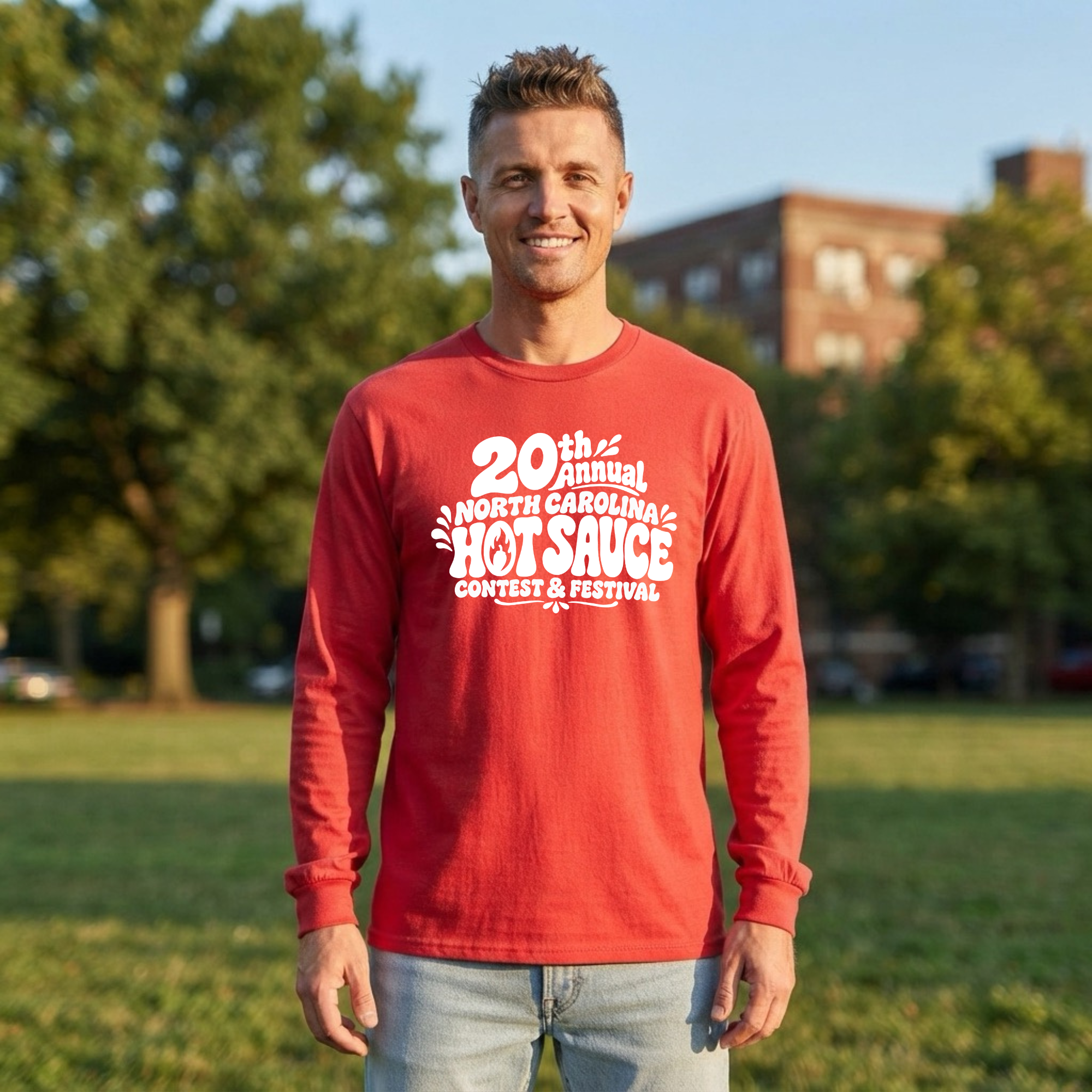 A man wearing a red long-sleeve t-shirt with a white graphic print that reads &