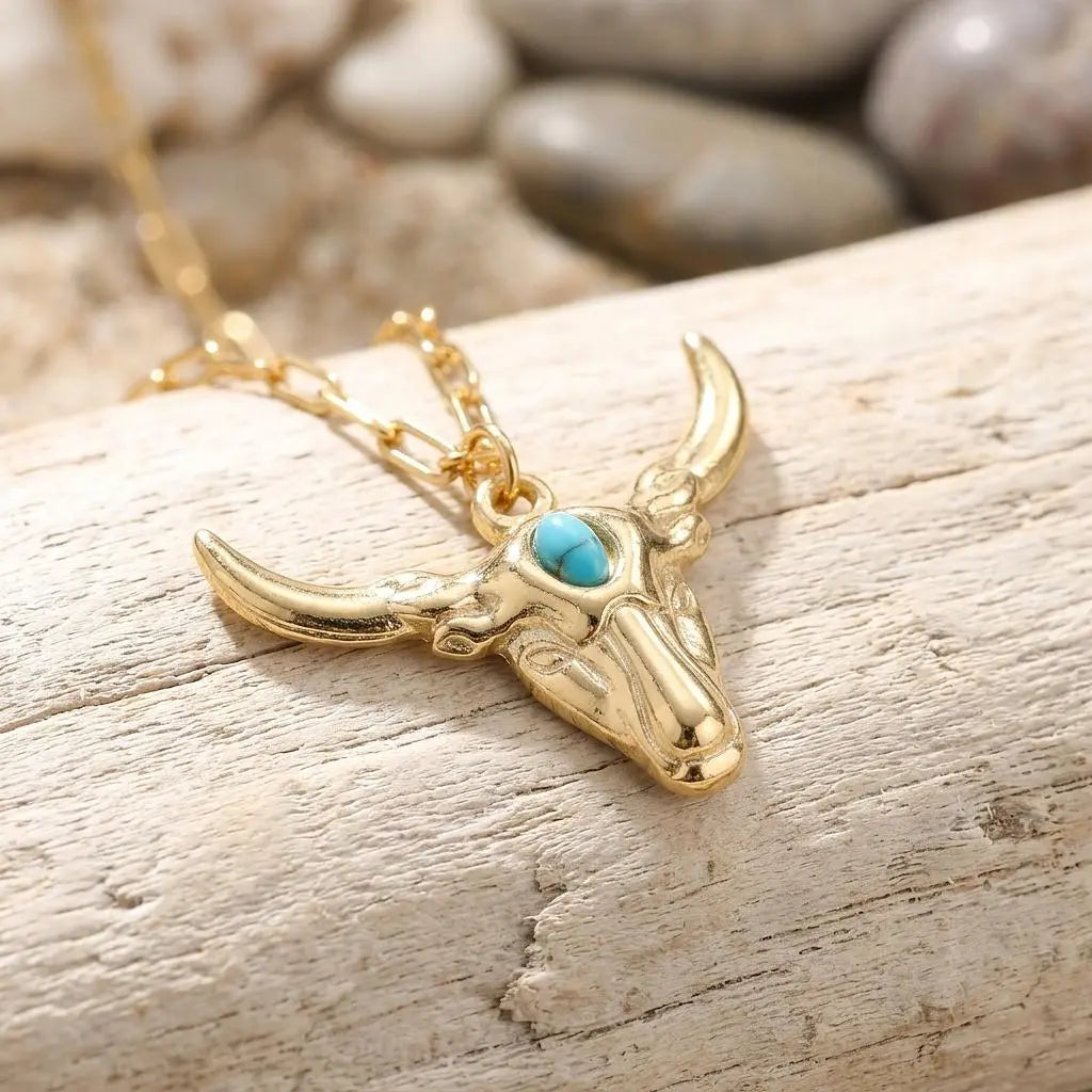 Longhorn charm with turquoise accent jewelry charm by Winks Design Studio, LLC, featuring a detailed longhorn and turquoise bead.