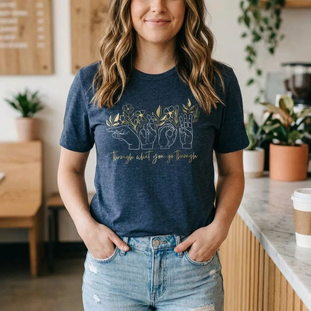 Winks Design Studio LLC Grow Through What You Go Through T-shirt featuring motivational text in black on soft cotton fabric.
