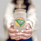 Person holding SCBA 16oz frosted glass with South Carolina Beekeeper Association logo