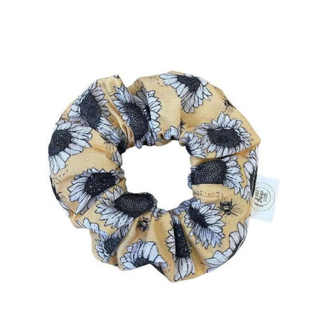 Sunflower scrunchie with vibrant sunflower pattern on soft cotton, perfect for adding a sunny touch to any hairstyle.