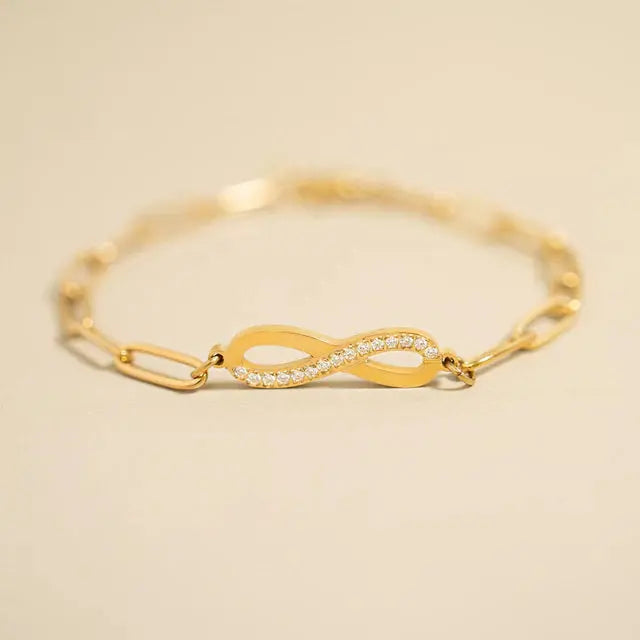 18K gold infinity chain bracelet by Winks Design Studio, LLC featuring a sleek, interconnected infinity link design.