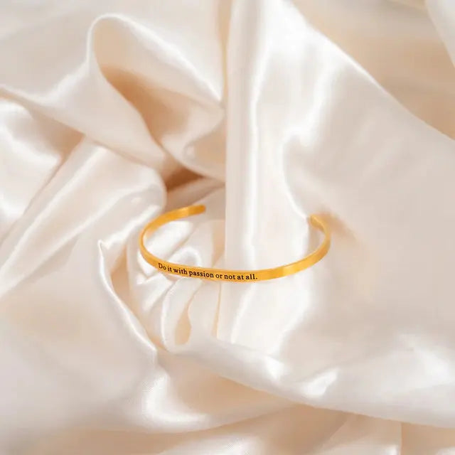 18K gold engraved bracelet by Winks Design Studio with "Do it with passion or not at all" inscription on stylish jewelry.