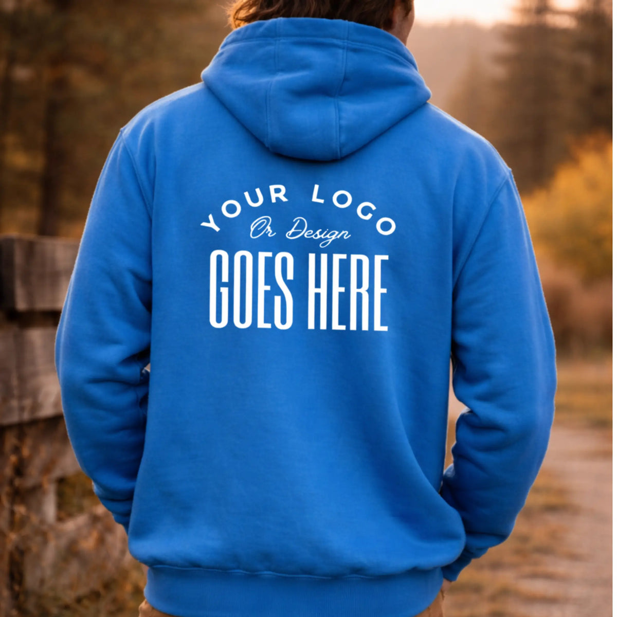 Water-repellent Carhartt Rain Defender heavyweight hoodie by Winks Design Studio, LLC, shown on a model outdoors.