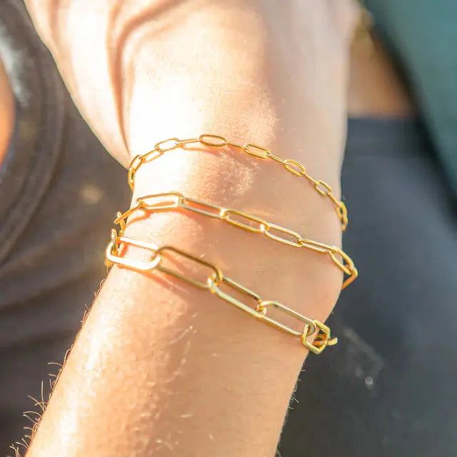 18K gold paperclip chain bracelet by Winks Design Studio, LLC, featuring a sleek, modern design with interconnected paperclip links.