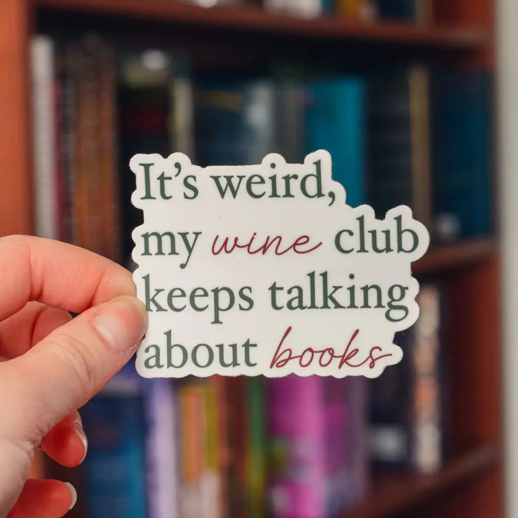 Vinyl sticker featuring "It’s Weird My Wine Club Keeps Talking About Books" design by Winks Design Studio, LLC.