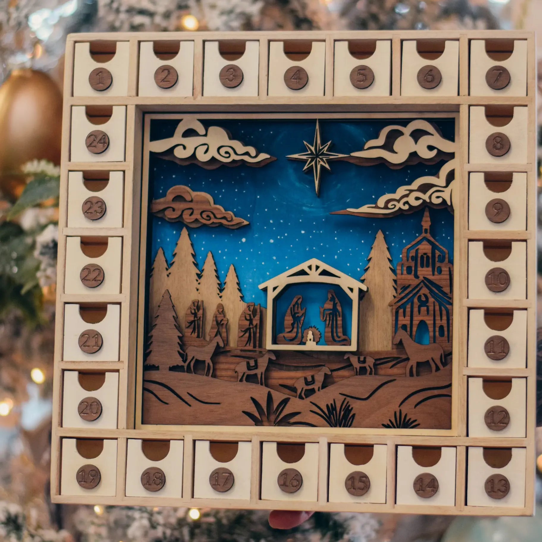 Winks Design Studio Nativity Advent Calendar Workshop Kit with colorful wooden pieces for holiday craft activity.