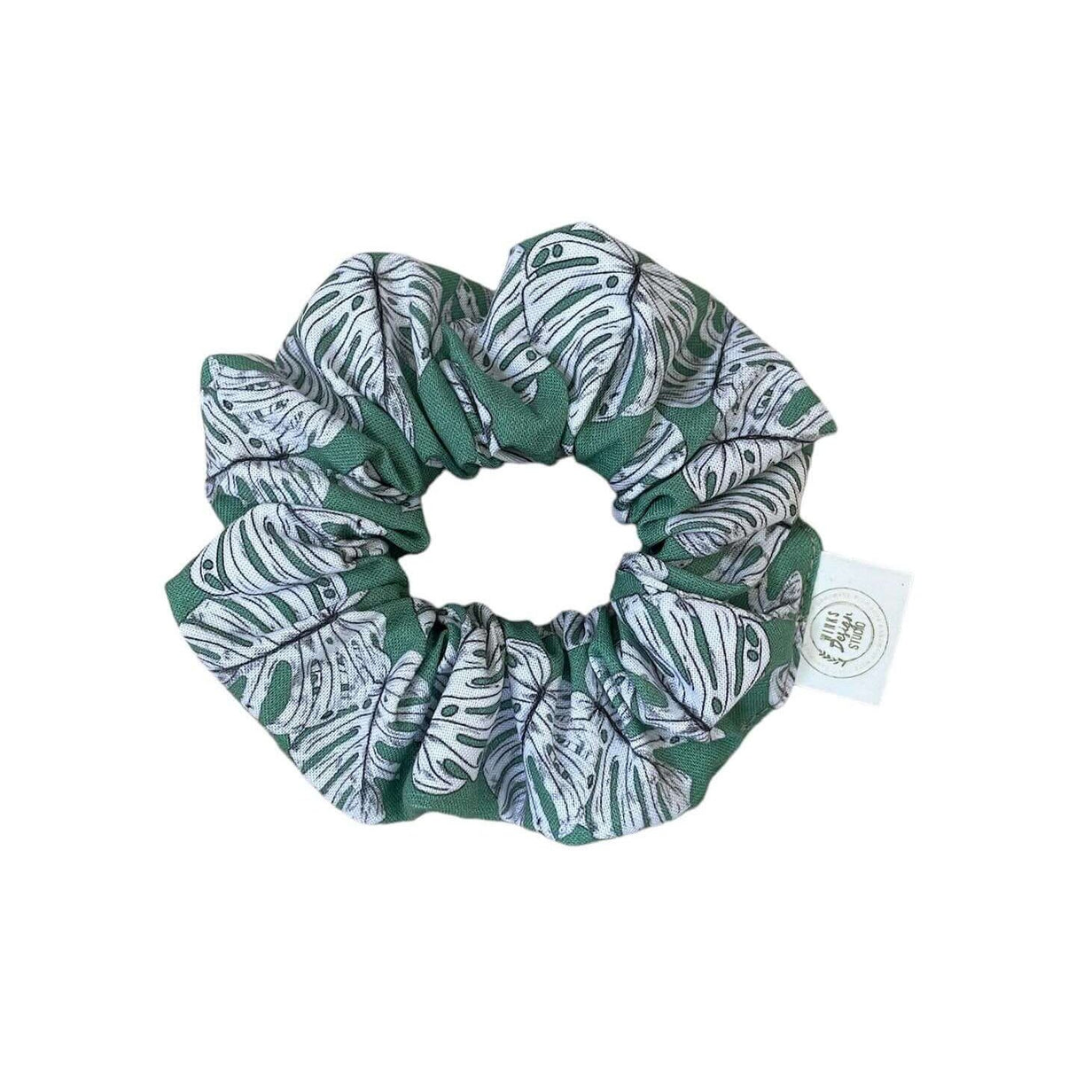 Monstera scrunchie with iconic leaf design, crafted from premium soft cotton fabric, perfect for adding a pop of tropical charm to hairstyles