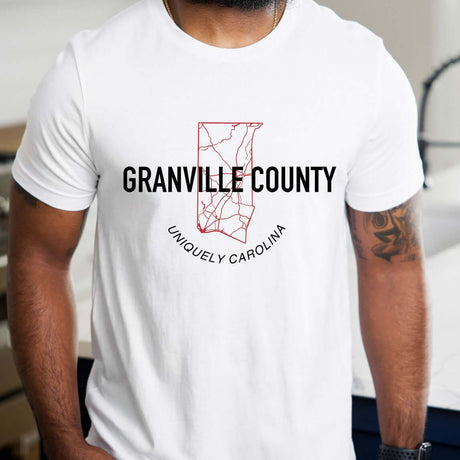 Granville County map outline t-shirt with red design and text "Uniquely Carolina" on a soft white cotton blend fabric.