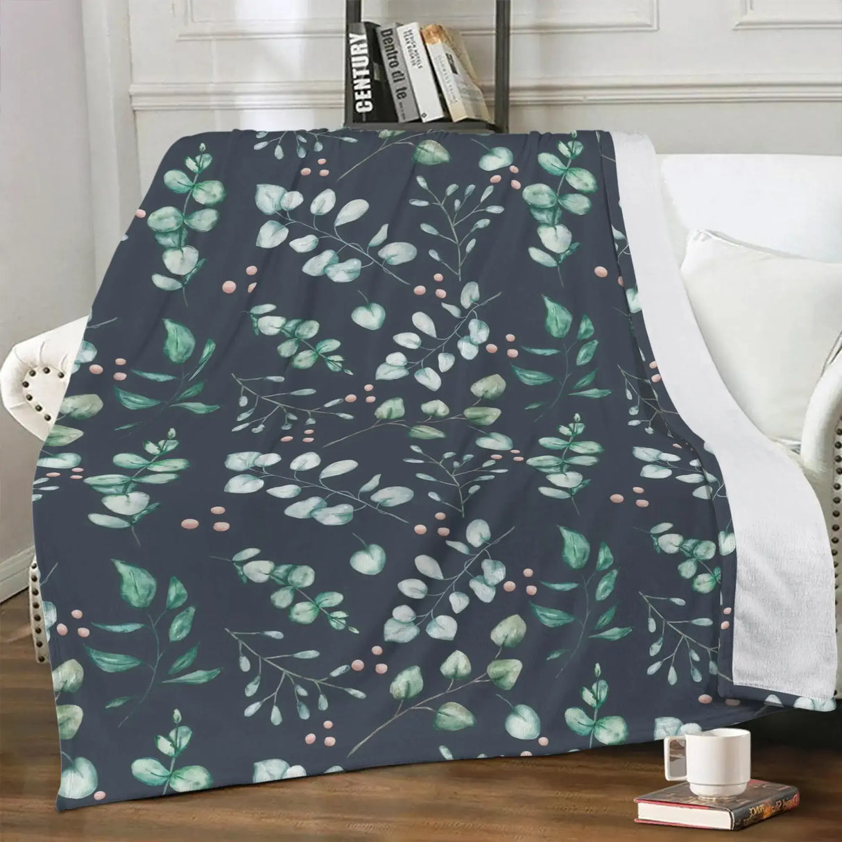 Eucalyptus floral blanket made from ultra-soft fleece, draped over a white chair in a cozy living room setting