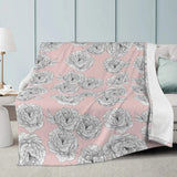 Pink Peony Flower Blanket with hand-drawn peony pattern, draped over a white sofa in a minimalist living room setting.